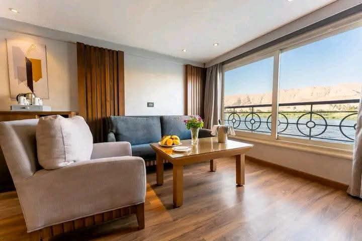 Cabin sitting area with armchairs and panoramic river windows