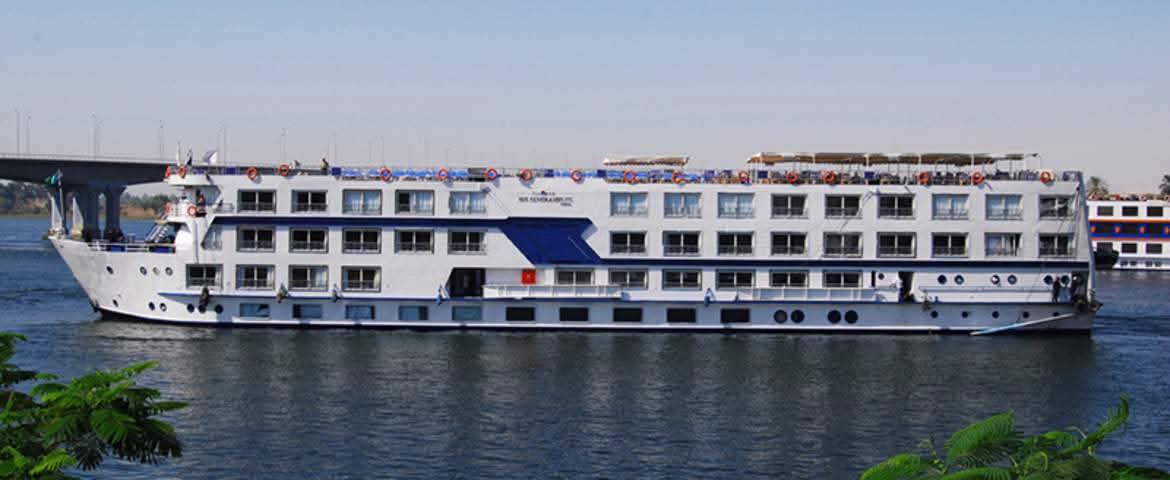 Side view of a white Nile cruise ship with blue accents